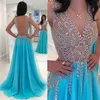 Luxury Rhinestones Backless Prom Klänningar Sheer V Neck Beading Kvällar En Linje Golvlängd Vestidos De Fiesta Tulle Formell Klänning