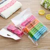 24 pçs / set Viagem Roupas de Lavanderia Pins Hanging Pegs Clips Gancho de Plástico Prendedores Prendedores De Papéis De Cozinha Casa de Banho Home Suprimentos