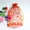 O design do coração para embrulhos de Natal sacos de organza com cordão sacos atacado sacos de doces pacote Jóias