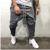 Coole mannen asymmetrische gelaagde joggerbroek hiphop streetwear joggerbroek slim fit casual trekkoord dichte onderkant lange broek groot 209M