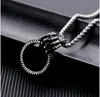 A new style of skull decoration, ghost hand, titanium steel men's pendant, movable tire pattern fitness Necklace