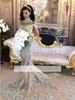 Dubaj Arabski luksus błyszczące 2019 Suknie ślubne seksowne bling koralikowe koronkowe aplikacje High Secion Illusion długie rękawy Syrenka Vintage B7023791