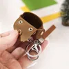 Creativo Mini Pu Hasp auricolare SD Coin Card di immagazzinaggio del sacchetto delle donne della moneta del raccoglitore della borsa della moneta di caso portachiavi Cinghia di sicurezza