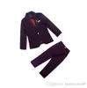 Vendita calda Abbigliamento per bambini primavera e autunno un vestito da ragazzo versione coreana bella scacchiera abito da capodanno set di tre pezzi cappotto camicia pantalone