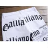 Hot heren John Males Galliano topkwaliteit punk rock nachtclub DS DJ krant bedrukt patroon slanke jeans motorjeans