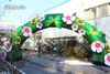 Böjd uppblåsbara blomsterbåge 10m Bredd Blow up Green Plants Archway med blommor för festhändelse och utomhus ingångsdörr dekoration