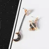 Version coréenne des nouvelles étoiles Moon Sangle Boucles d'oreilles Femme Femme Spot de bijoux de boucle d'oreille asymétrique Feme