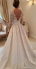 New Sexy Elegant Long Sleeve Wedding Dresses A Line Sheer Neckline Backless Lace and Satin Sweep Train Bridal Wedding Gowns