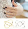 Nya ankomster Hot Fashion Women's Ring Guldfärg och Silver Plated X Cross Stereo Surround Hollow Ring för Kvinnor Smycken
