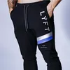 Novas calças de corrida masculinas casuais calças de moletom fitness esportivas calças lápis de algodão academias de ginástica masculinas skinny track