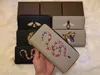 女性のアニマル柄のジッパー財布、最もスタイリッシュなカードとコインの有名なデザインのメンズレザー財布カードホルダー
