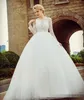 2019 Long Sleeves Ballgown Wedding Dresses Sheer Neck Lace Applique Sweep Train Chic Illusion Covered Buttons Back Wedding Bridal Gown