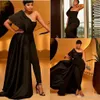 Plus Size African Sexy Black Jumpsuit Prom Dresses Appliques Paillettes Una spalla Overskirts Abiti da sera con tailleur pantalone Abiti da festa