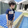 Kids Cotton Plaid Plaid Plaid Summer Children New Lapel Pliad Short Sleeve Tops Boys and Girls Cotton Tshirt Navy White A016068638158