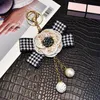 Rhinestone Ball Sleutelhangers Sleutelhangers Houder Plaid Boog Camellia Bloem Sleutelhanger Ring Sieraden Gift Mode Vrouwen Meisjes Parelzak Charms voor Auto