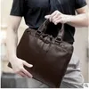 Versión coreana del bolso del bolso del hombre que sostiene una bolsa maletín de negocios macho estilo horizontal que lleva un bolso expreso hombre de negocios