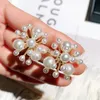 Nieuwe ins mode hot style ontwerper luxe parel bloemenstop oorbellen voor vrouw meisjes zilveren pin