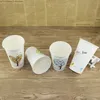 alta qualità 50pcs tazza di caffè usa e getta addensare tazza di carta cartone animato amore albero latte tè caffè succo di frutta bevande tazze di imballaggio con coperchi 500 ml