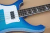 4-saitige blaue E-Bassgitarre für Linkshänder mit weißem Schlagbrett und Palisandergriffbrett