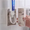 EcoCo Automatisk tandkräm Dispenser Dammsäker tandborstehållare Väggmonteringsstativ Badrumstillbehör Ställ tandkräm squeezer
