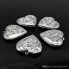 10 pezzi di modelli o disegni intagliati in argento su legno, ciondolo con ciondolo a medaglione a forma di cuore, piccolo pendente da 28 mm, accessori moda