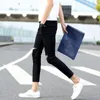Jeans da uomo all'ingrosso da uomo 2023 moda foro al ginocchio autunno piedi bianchi lunghezza alla caviglia pantaloni a matita slim coreani