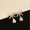 Koreanische Art und Weise Luxus Intarsien Zirkon bowknot Tropfenohrschmuck High-End-18K Gold überzogen exquisite Ohrringe modische sexy Damen Ohrringe