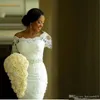 Billiga Luxury Mermaid Bröllopsklänningar Av Skulder Full Lace Applique Beaded Sash 3/4 Långärmade Sweep Train African Nigerian Bridal Gowns