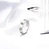 Titanium Steel Wedding Brand Designer Lovers Ring For Women Luxury Luxury Zirconia Rings de fiançailles Men Bijoux entiers Cadeaux Fashion A3310750