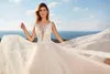 Eddy K En linje bröllopsklänningar Sheer v Neck Lace Appliques Tulle Bridal Gowns Illusion Backless Beach Sweep Train Wedding Robes de Mariée