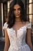 Nya Designl Appliques Lace V-Neck Cap Sleeve Tulle Pärlor En Linje Bröllopsklänningar 2020 Boho Bridal Gown Vestido de Noiva