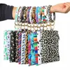 Pulsera de PU Llavero Llavero de muñeca de cuero Llavero redondo de leopardo Pulseras Bolso Colgante Monedero Bolso de mano para mujer Monedero Bolsa de maquillaje