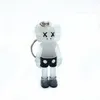 KAWS muñeca BFF Llavero estéreo 3D Colección del cráneo colgante Brian Calle Acción Arte Figura versión limitada del modelo de juguete de regalo correas Nuevo encanto del bolso