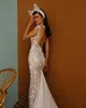 2020 Splendidi abiti da sposa a sirena con illusione Abito da sposa con applicazioni di pizzo gioiello Sweep Lunghezza Backless Abito da sposa di vendita calda su misura