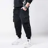 Januarysnow Printemps Hip Hop Joggers Hommes Noir Sarouel Multi-poches Rubans Homme Pantalons De Survêtement Streetwear Casual Hommes Grande Taille 6XL 7XL