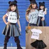 Nytt mode småbarn barnflickor klädsatta sommaren kort ärm mini boss thirt topps läder kjol 2st outfit child designer su7692073