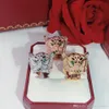 Anillo de leopardo Marca Joyería de fiesta de moda clásica para mujeres Oro rosa Patrón negro Pantera Boda Lujosa Perforación completa Men037035170