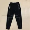 الرجال العاكسة ليلة الجري Sportpants الذكور عارضة ضوء رقيقة رقيقة فضفاضة الساق الصغيرة السراويل سريعة التجفيف تنفس السراويل