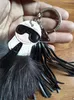 Luxury Fluffy Karl äkta tvättbjörn päls Pompom Monster Bag Bugs Charm Keychain Plush Key Ring Leather Tassel QBZD