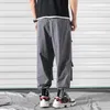 Nowy Spring Joggers Ankel-Długość Spodnie Harema Męskie Front Kieszenie Dresy Męskie Luźne Harajuku Hip Hop Track Spodnie 5xl Mid Flat