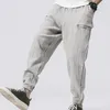 Pantaloni da uomo in lino di cotone hip-hop di alta qualità con coulisse in vita, pantaloni larghi a matita, pantaloni sportivi Harem casual