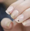 UVゲルカバーFalse Nails Gold Glitter Nude LadiのPresser in Fingernails ondernails youse with接着剤タブ付き
