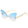 2021 lebensechte Schmetterlings-Design, modische Damen-Sonnenbrille, randloser Stil mit flachen Gläsern und vergoldeten Metall-Hohlbügeln
