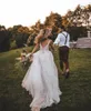 Abiti da sposa sexy da spiaggia Boho Abiti da sposa 2021 Profondo scollo a V Pizzo Perline Sweep Train Tulle Senza maniche Aperto indietro Abito da sposa Vestidos