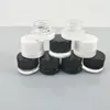 vasetti di vetro antiaderente bianco trasparente nero bottiglie da 5 ml contenitore dab da 9 ml con coperchio a resistenza per bambini vetro per concentrato di olio denso di cera