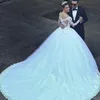 Luxury White Tulle Ball Gown Wedding Dresses With Illusion Long Sleeves Off Shoulder Lace Appliques Train Bridal Gowns Vestidos de Novia