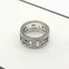 Titanium steel jewelry hollow G letter pattern ring lovers square Gshaped Arabic engraved pattern ring3404143