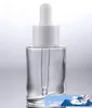 Partihandel 30ml Glass Dropper Pipettflaska Amber Clear Frosted Cosmetics Cream Container med svarta vita lock