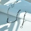 LONDANY Set di bracciali con collana corta con nappa e catena di strass neri, collana da donna con cuciture in metallo a vento freddo1
