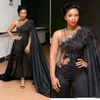Sexig svart illusion jumpsuits prom klänningar med cape wrap 2022 Sydafrika spets applique långa kvällsklänningar pärlstaven Kvinnor formell fest slitage